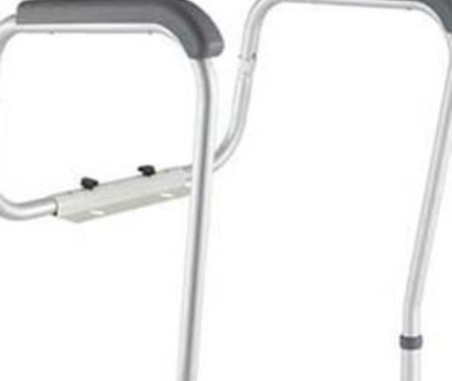 Toilet safety frame with padded armrests